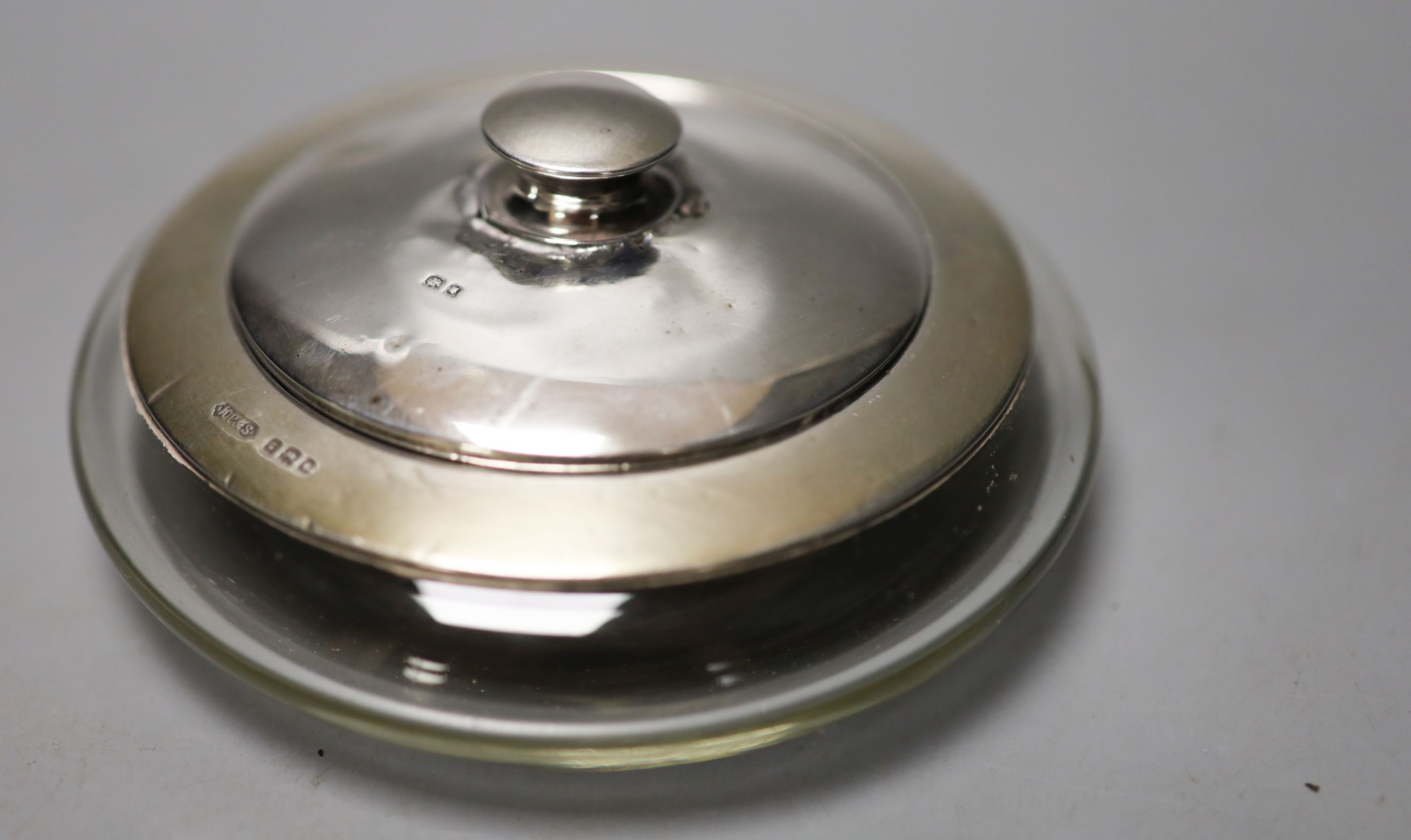 Six assorted silver mounted glass toilet jars, including a powder bowl and a Chinese white metal tot(a.f.).